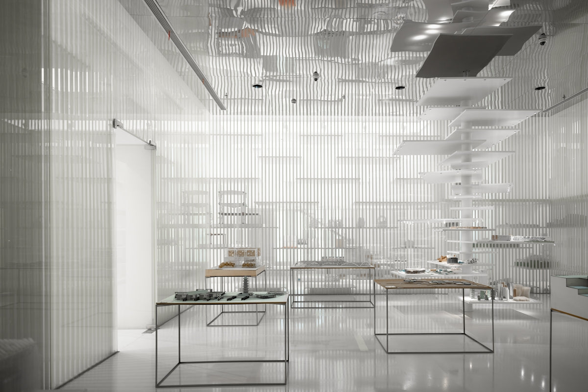 a room filled with lots of white furniture