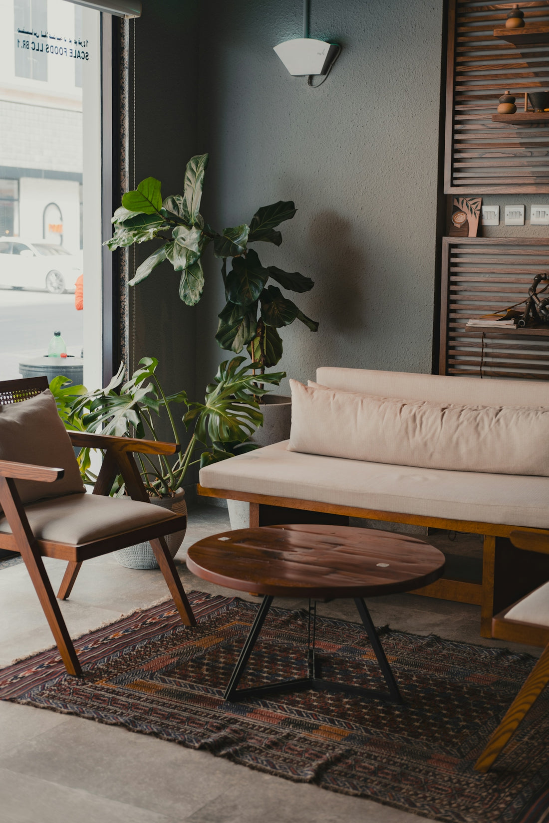 A living room filled with furniture and a large window