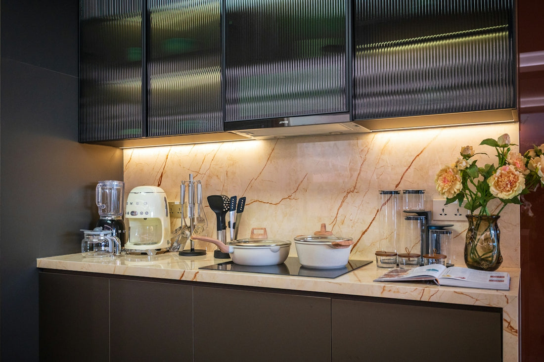 Modern kitchen counter with appliances and flowers